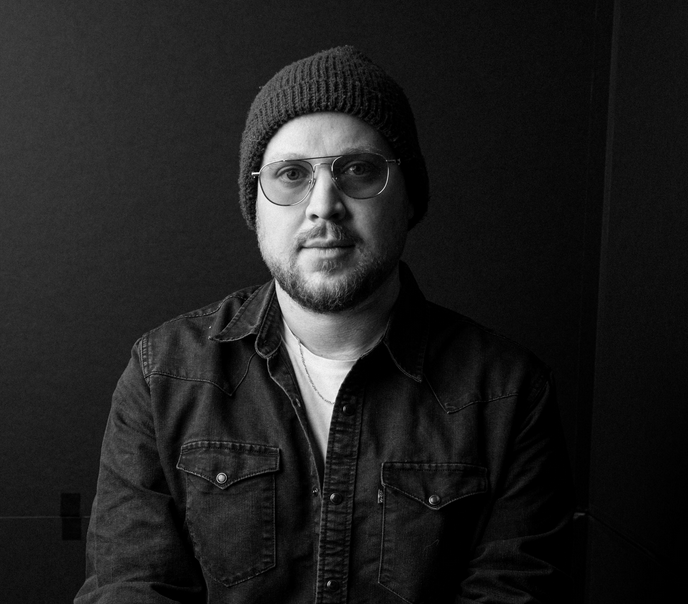 Black and white headshot of Métis author Conor Kerr.